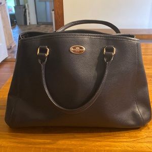Women’s leather Coach handbag.